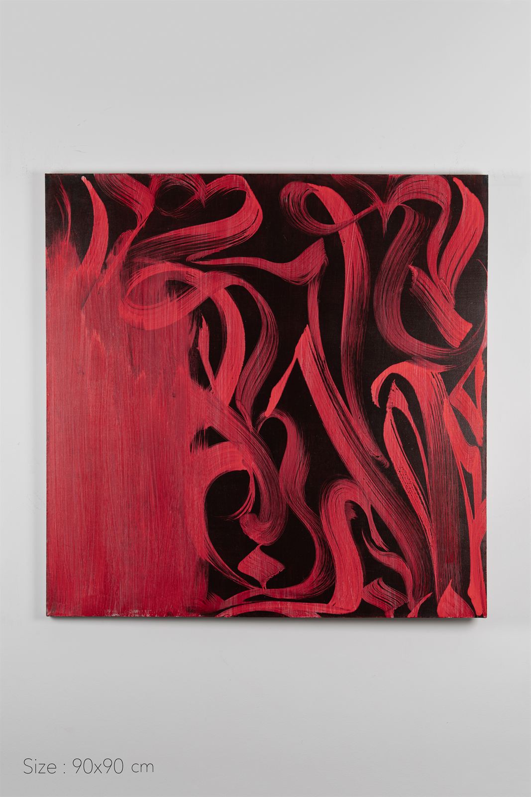 Red calligraphic loops weaving across a black square canvas